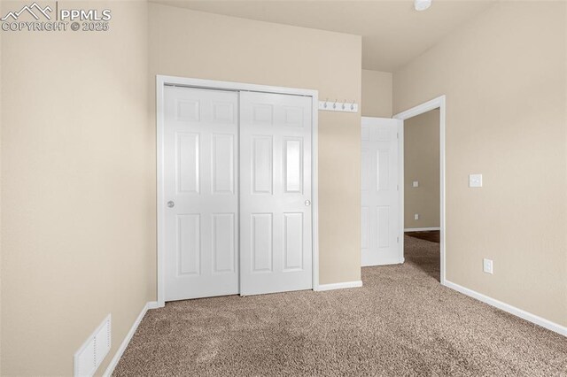 9712 Wando Dr, Colorado Springs, CO 80925 - unfurnished bedroom with carpet flooring, baseboards, a closet, and visible vents