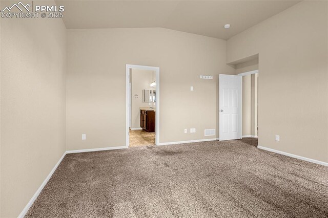 9712 Wando Dr, Colorado Springs, CO 80925 - carpeted empty room with baseboards, lofted ceiling, and visible vents