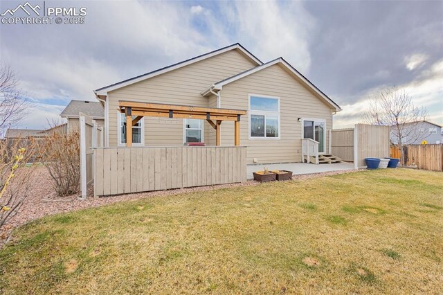 9712 Wando Dr, Colorado Springs, CO 80925 - rear view of property with a patio area, entry steps, fence, and a lawn