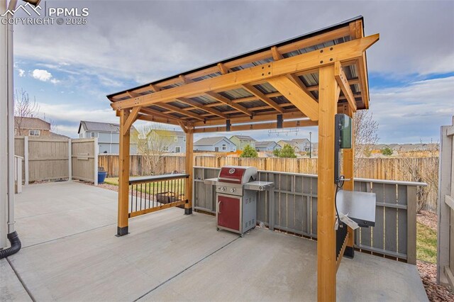 9712 Wando Dr, Colorado Springs, CO 80925 - view of patio / terrace with a grill and fence