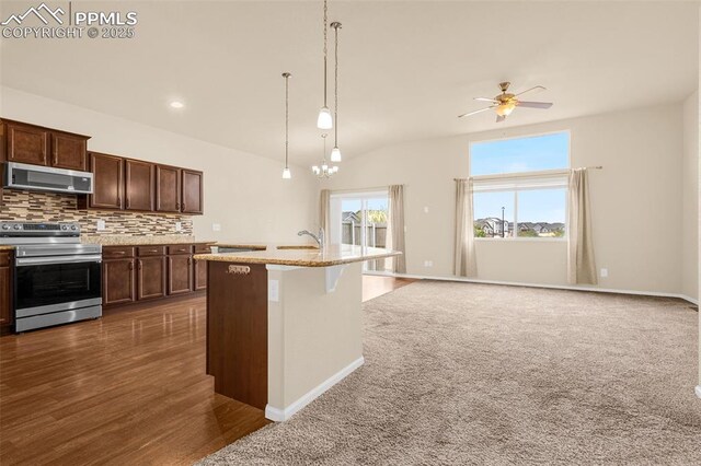 9712 Wando Dr, Colorado Springs, CO 80925 - kitchen with backsplash, a sink, pendant lighting, ceiling fan, and appliances with stainless steel finishes