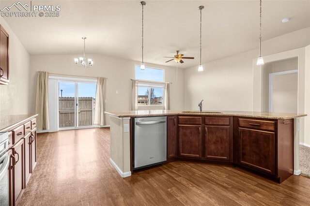 9712 Wando Dr, Colorado Springs, CO 80925 - kitchen with dark wood-style flooring, dishwasher, a sink, ceiling fan with notable chandelier, and vaulted ceiling
