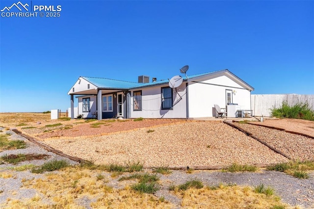 2801 Lime Rd, Pueblo, CO 81006 - view of front of home with metal roof and fence