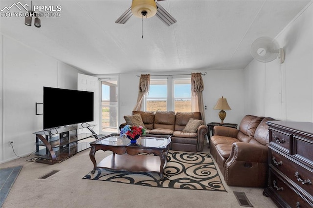 2801 Lime Rd, Pueblo, CO 81006 - carpeted living room with visible vents and a ceiling fan