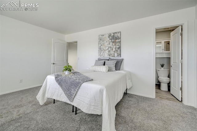 bedroom featuring baseboards, carpet flooring, and ensuite bath