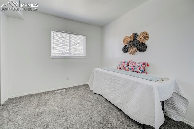 bedroom featuring visible vents, baseboards, and carpet