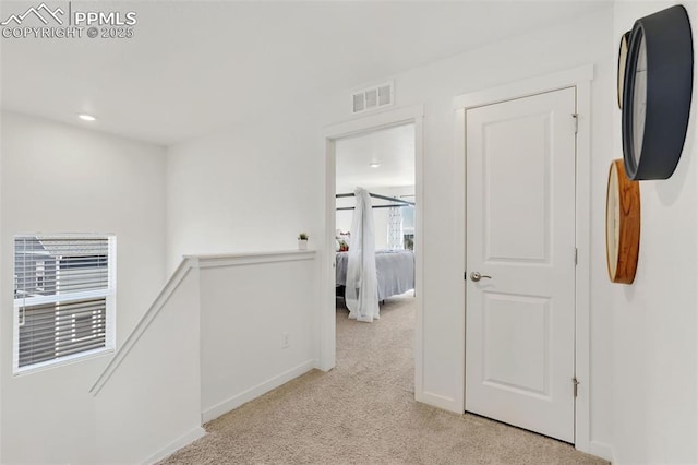 15833 Little Bluestem Rd, Monument, CO 80132 - hall with visible vents, baseboards, an upstairs landing, and light colored carpet