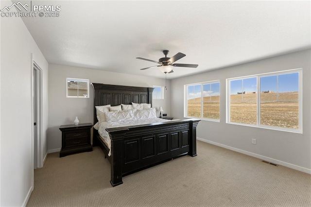 5894 Spring Breeze Dr, Colorado Springs, CO 80923 - bedroom featuring visible vents, baseboards, ceiling fan, and light colored carpet