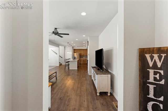 5894 Spring Breeze Dr, Colorado Springs, CO 80923 - hall featuring recessed lighting, baseboards, dark wood finished floors, and stairs