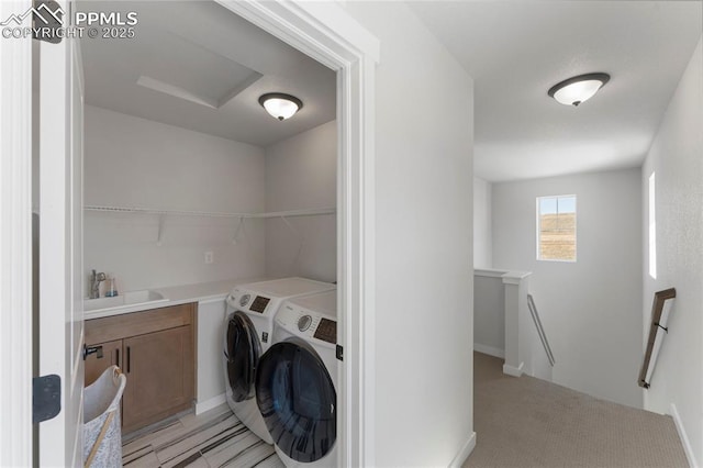 5894 Spring Breeze Dr, Colorado Springs, CO 80923 - clothes washing area with a sink, laundry area, independent washer and dryer, attic access, and light colored carpet