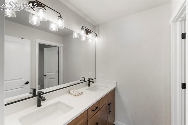 5894 Spring Breeze Dr, Colorado Springs, CO 80923 - bathroom featuring a sink, toilet, and double vanity