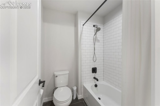 5894 Spring Breeze Dr, Colorado Springs, CO 80923 - full bath featuring tile patterned flooring, shower / bathtub combination, baseboards, and toilet