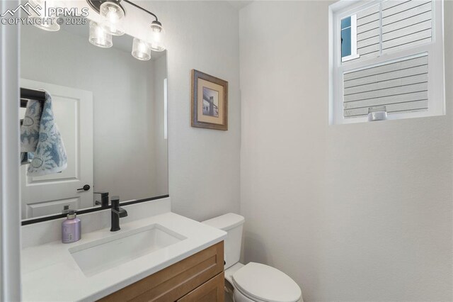 5894 Spring Breeze Dr, Colorado Springs, CO 80923 - half bath with vanity and toilet