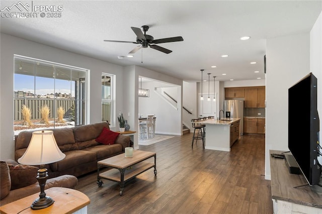 5894 Spring Breeze Dr, Colorado Springs, CO 80923 - living area with dark wood-type flooring, a ceiling fan, recessed lighting, stairs, and baseboards