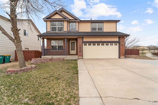 795 Ridgebury Pl, Fountain, CO 80817 - view of front of home with concrete driveway, fence, covered porch, and brick siding