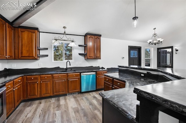 kitchen with a notable chandelier, plenty of natural light, a sink, and dishwashing machine