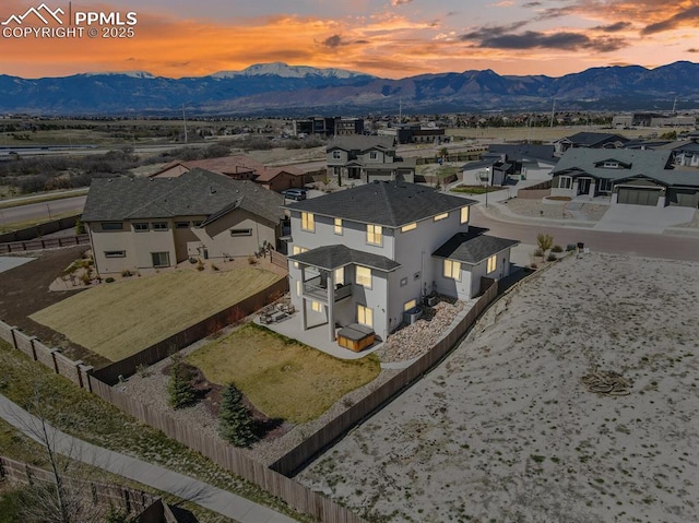birds eye view of property featuring a mountain view and a residential view