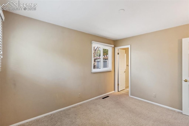 2928 Drakestone Dr, Colorado Springs, CO 80909 - spare room featuring baseboards, carpet flooring, and visible vents