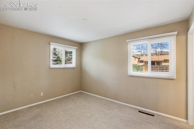 2928 Drakestone Dr, Colorado Springs, CO 80909 - carpeted spare room featuring visible vents and baseboards