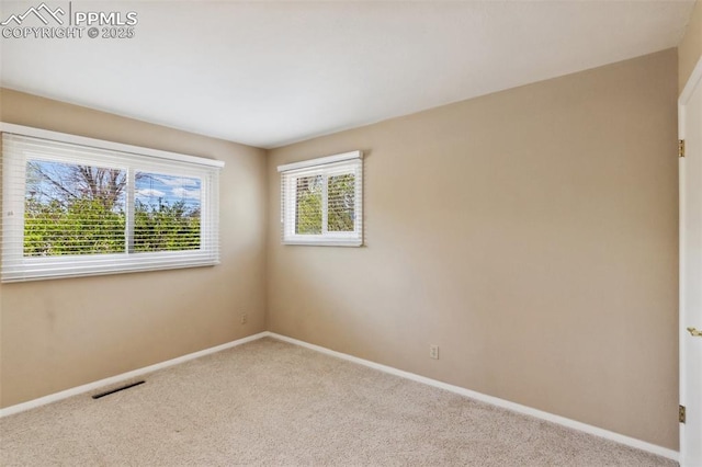 2928 Drakestone Dr, Colorado Springs, CO 80909 - empty room with visible vents, baseboards, and carpet floors