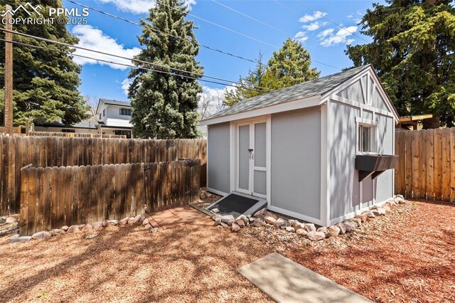 2928 Drakestone Dr, Colorado Springs, CO 80909 - view of shed with a fenced backyard