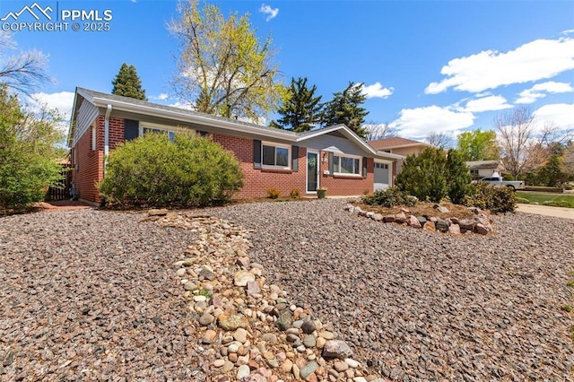 2928 Drakestone Dr, Colorado Springs, CO 80909 - single story home featuring brick siding and a garage