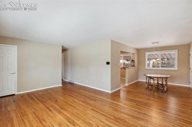 2928 Drakestone Dr, Colorado Springs, CO 80909 - spare room featuring baseboards, visible vents, and light wood-style flooring
