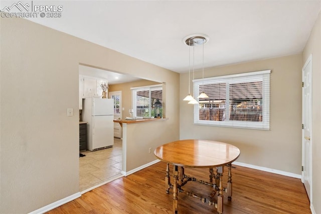 2928 Drakestone Dr, Colorado Springs, CO 80909 - dining space featuring baseboards and light wood-style floors