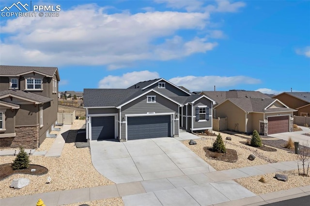 12980 Stone Valley Dr, Peyton, CO 80831 - view of front of home with a garage, driveway, and a residential view