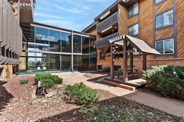 exterior space with a patio and a community pool