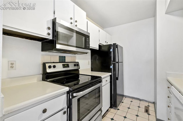 kitchen with tasteful backsplash, light countertops, white cabinetry, stainless steel appliances, and light floors