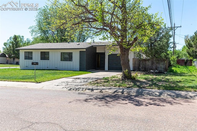 405 Aztec Dr, Colorado Springs, CO 80911 - ranch-style home featuring board and batten siding, a garage, and driveway
