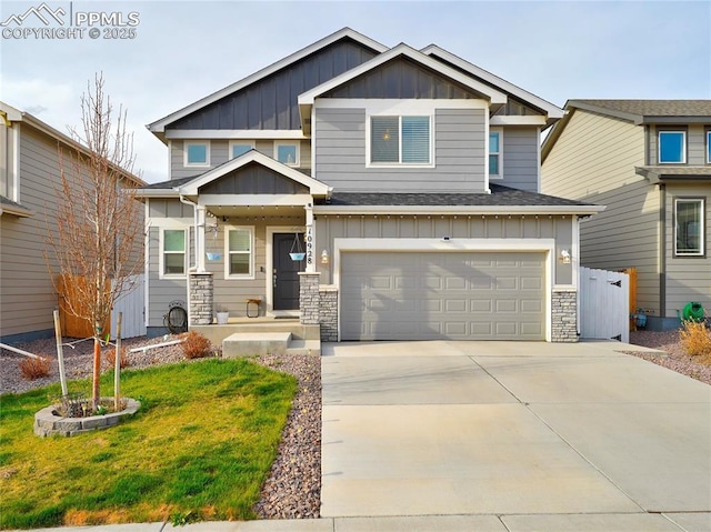 craftsman inspired home with stone siding, concrete driveway, fence, an attached garage, and board and batten siding