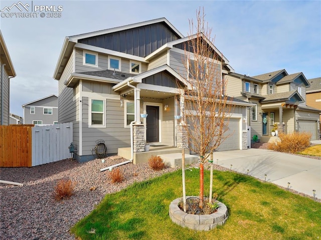 craftsman-style house featuring driveway, a front yard, fence, board and batten siding, and a garage