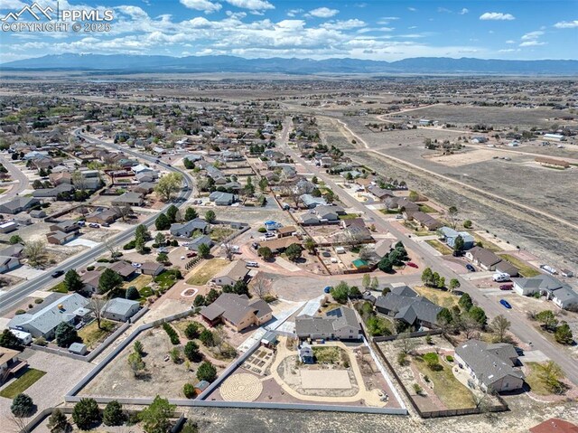 birds eye view of property with a residential view and a mountain view