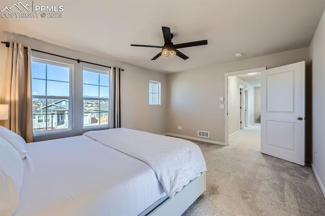 bedroom featuring light carpet, baseboards, a ceiling fan, and visible vents