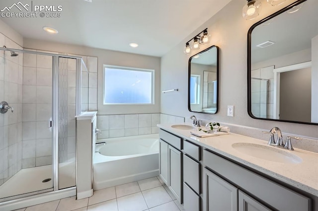 bathroom featuring tile patterned floors, a sink, and a stall shower