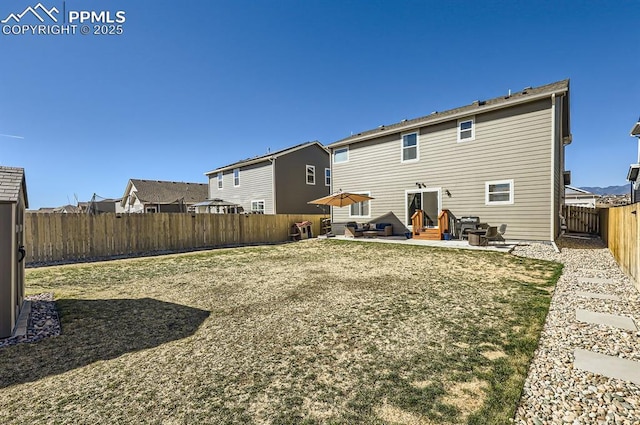 back of house featuring a patio, entry steps, and a fenced backyard