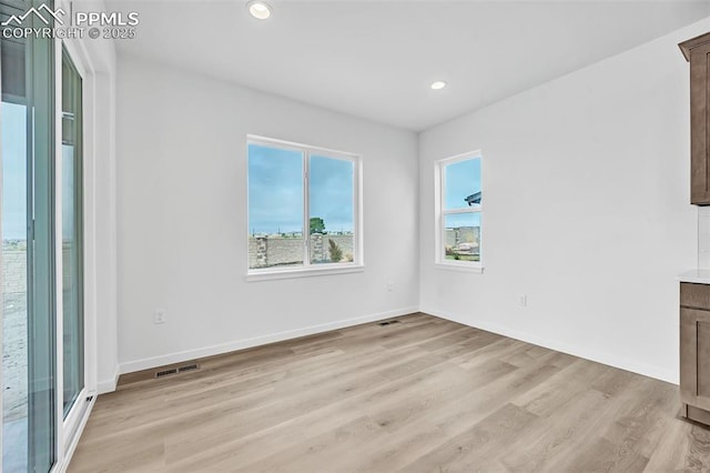 8532 Noreen Falls Dr, Colorado Springs, CO 80924 - empty room with light wood finished floors, recessed lighting, and baseboards