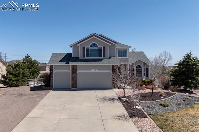 9811 Carrington Dr, Peyton, CO 80831 - traditional-style home with concrete driveway, fence, and a garage