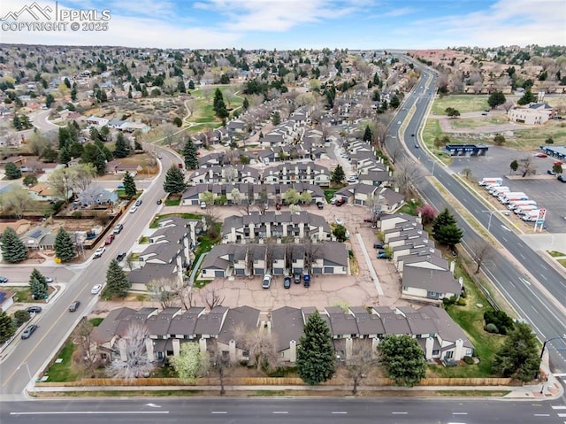 birds eye view of property with a residential view