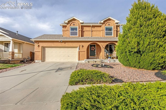2951 Poughkeepsie Dr, Colorado Springs, CO 80916 - view of front of property featuring concrete driveway, a porch, stucco siding, and an attached garage