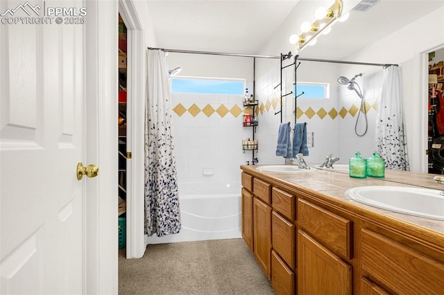 2951 Poughkeepsie Dr, Colorado Springs, CO 80916 - bathroom with a sink, visible vents, double vanity, and shower / bath combination with curtain