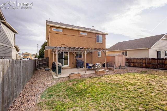 2951 Poughkeepsie Dr, Colorado Springs, CO 80916 - back of house with an outbuilding, a pergola, stucco siding, a lawn, and a patio area