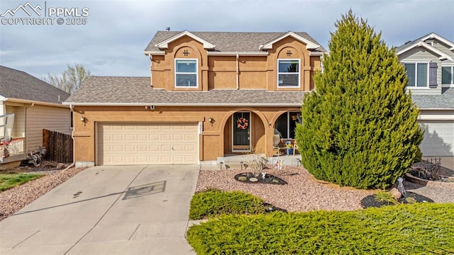 2951 Poughkeepsie Dr, Colorado Springs, CO 80916 - view of front of house with roof with shingles, driveway, and stucco siding