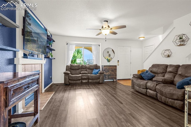 2951 Poughkeepsie Dr, Colorado Springs, CO 80916 - living room featuring ceiling fan, baseboards, wood finished floors, and a fireplace