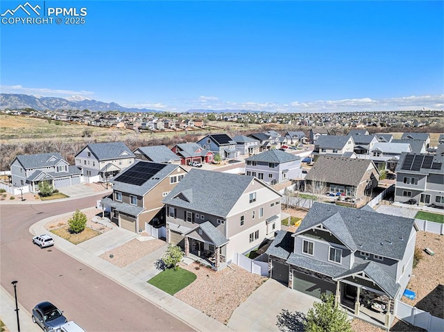 bird's eye view featuring a residential view and a mountain view