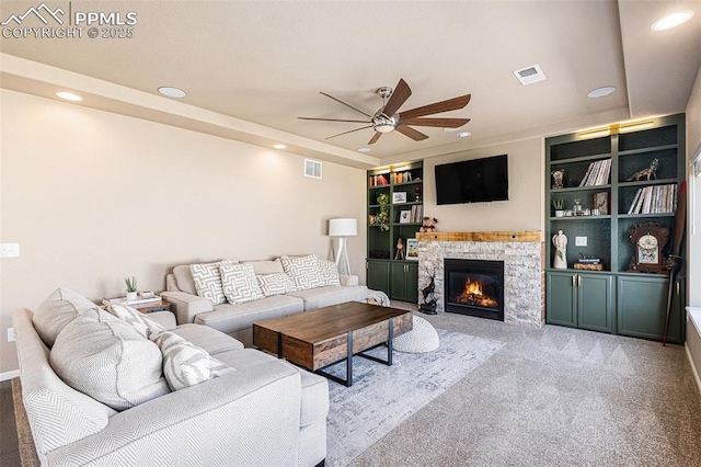 carpeted living room with recessed lighting, a ceiling fan, visible vents, and a fireplace
