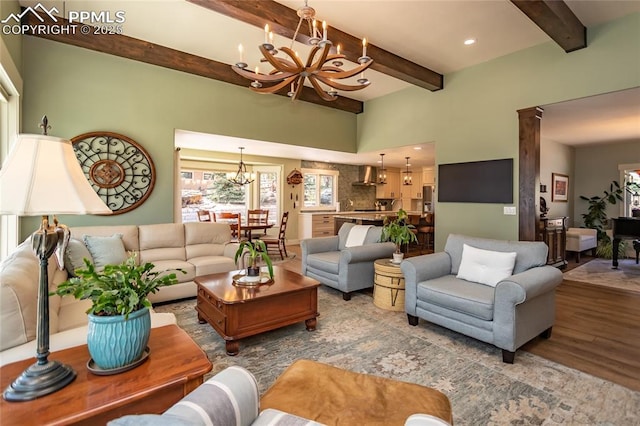 18383 Lazy Summer Way, Monument, CO 80132 - living area with a chandelier, wood finished floors, beamed ceiling, and recessed lighting