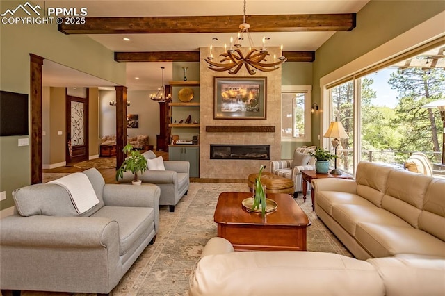 18383 Lazy Summer Way, Monument, CO 80132 - living area with a chandelier, a fireplace, beamed ceiling, baseboards, and recessed lighting